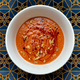 Bowl of gazpacho on graphic background
